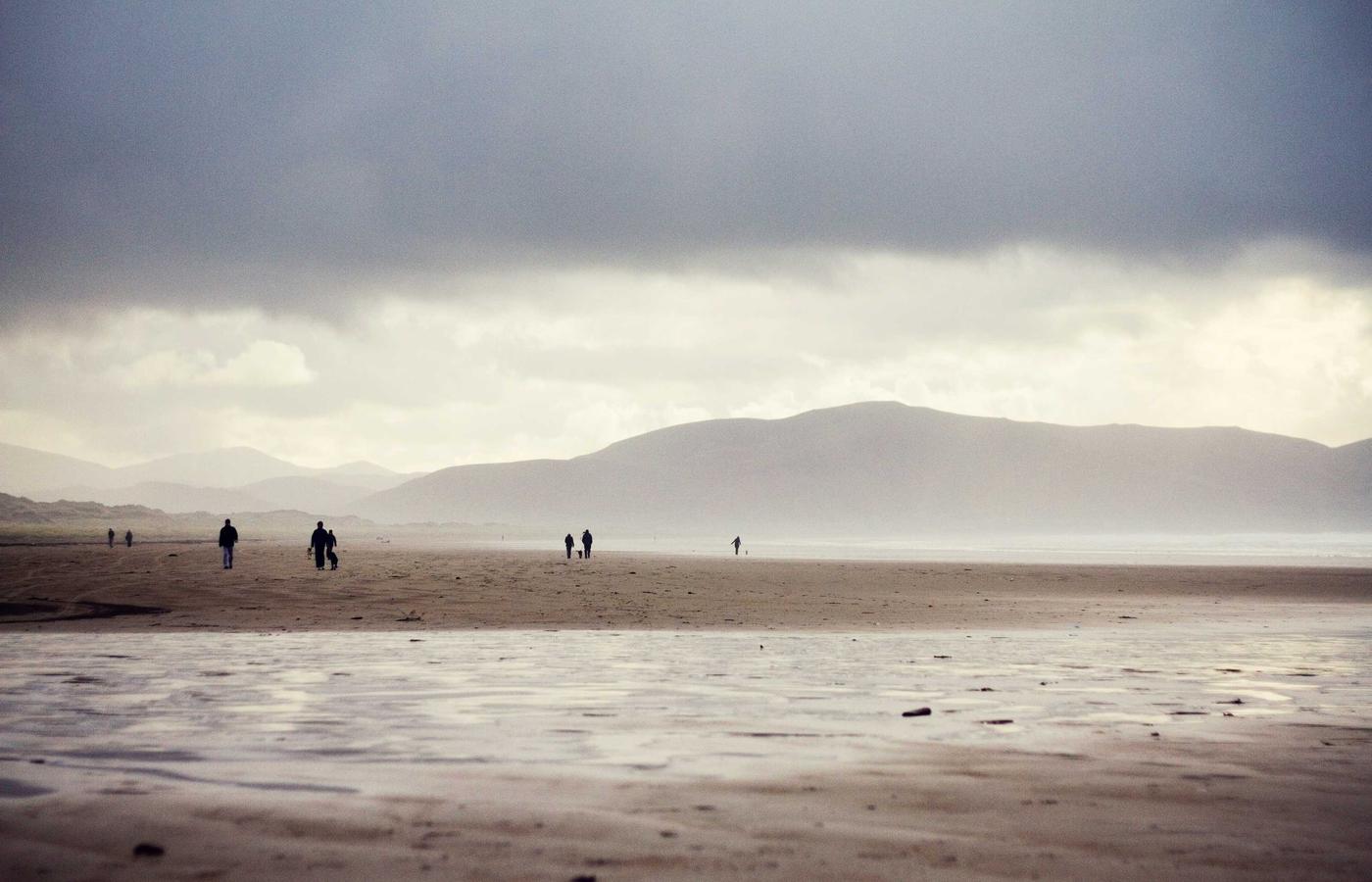 People sharing a meal together at an outdoor table